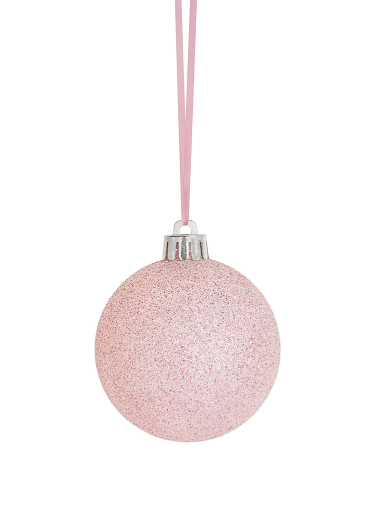 Photo hanging pink christmas ornament isolated on white background