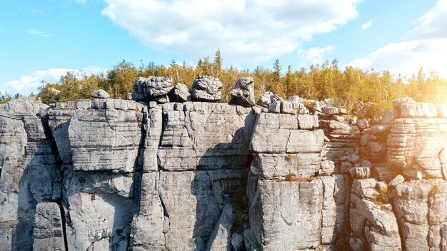 Hanging rocks in the mountains against the sky