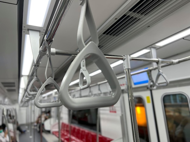 Hanging straps in Subway , empty background of metro train