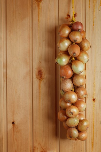 Hanging strings of white onions