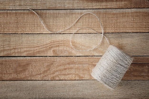 Hank of hemp twine on wooden background