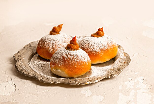 Hanukkah donuts on a vintage plate.