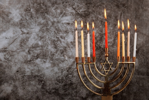 Hanukkah menorah with burning candles