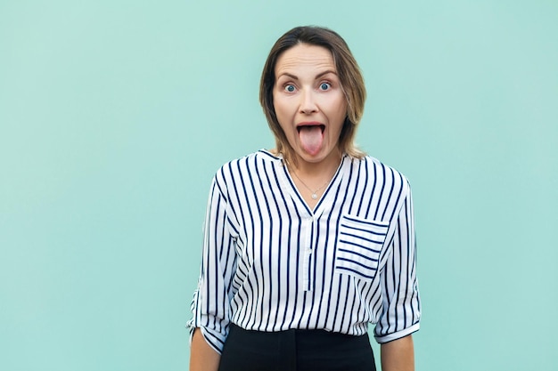 Happiness businesswoman looking at camera with big eyes and tongue out