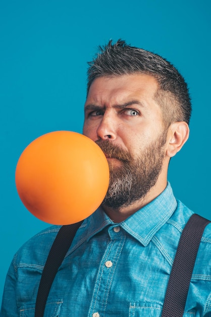 Happiness celebrating birthday preparation to party happy family handsome bearded man inflating