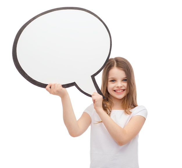 happiness, child, conversation and people concept - smiling little girl with blank text bubble