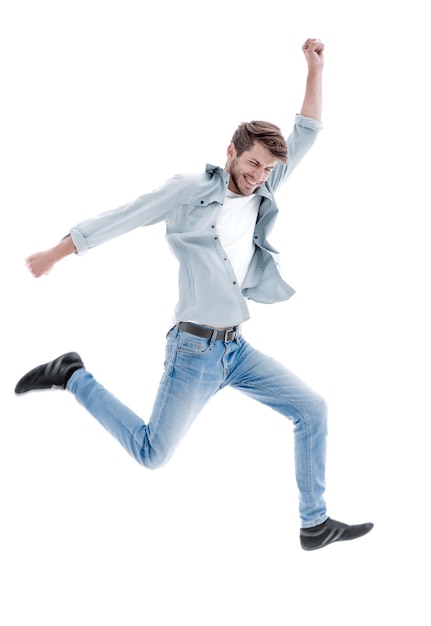 Happiness freedom movement and people concept smiling young man jumping in air