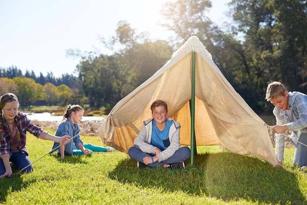 happiness is going on a camping trip shot of a group of children on a camping trip