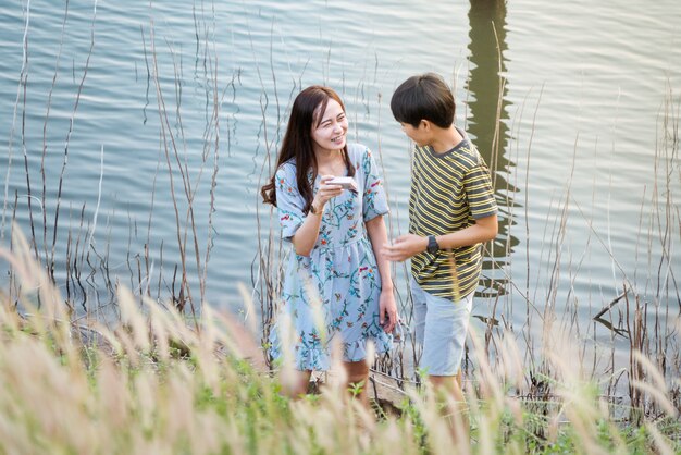 Happiness lover standing by lake