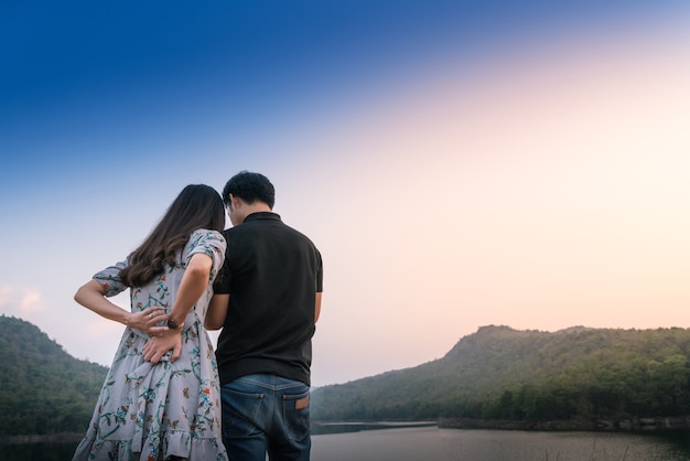 Happiness lover standing by lake