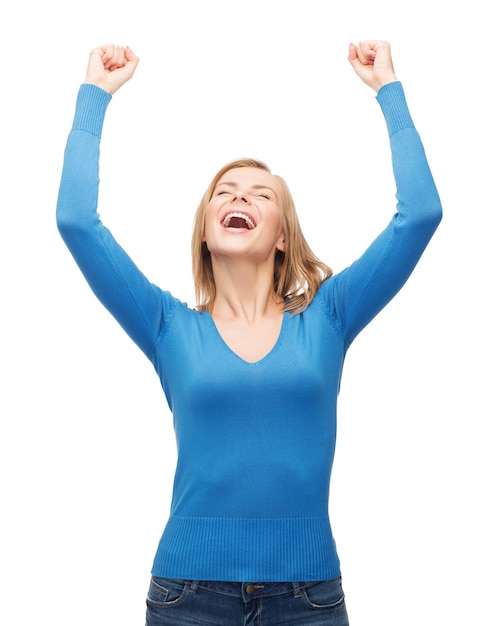 happiness and people concept - laughing young woman with hands up and closed eyes