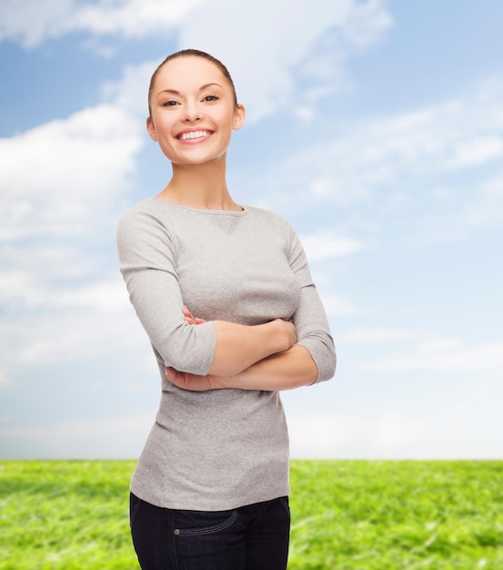 happiness people concept - smiling asian woman with crossed arms over white background