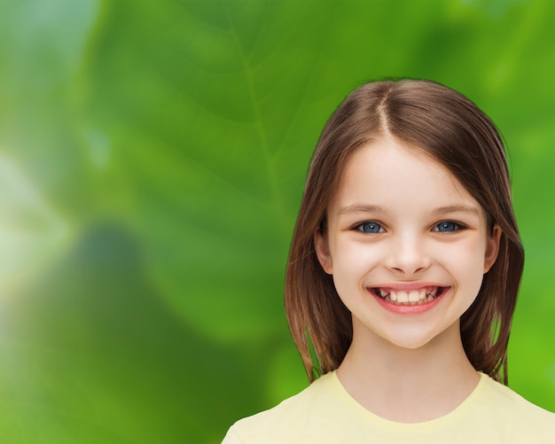 happiness and people concept - smiling little girl over white background