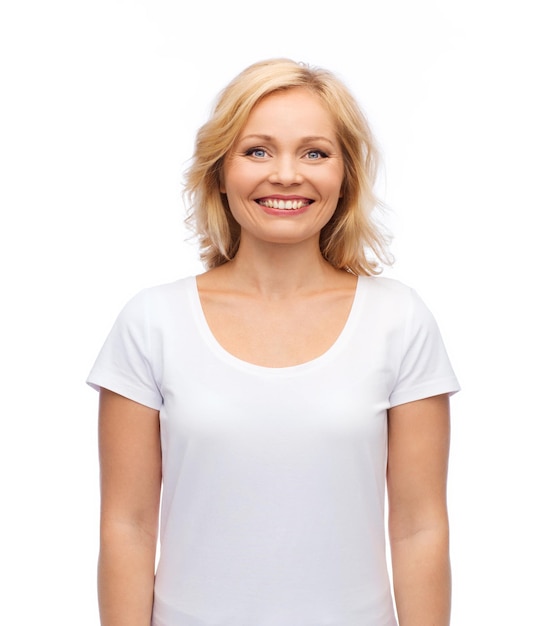 happiness and people concept - smiling woman in blank white t-shirt