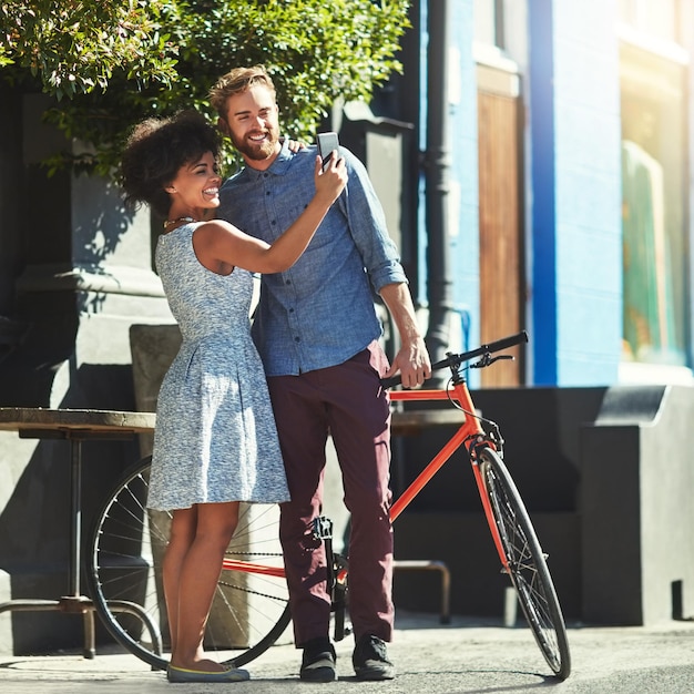 Happiness selfie and diversity couple of city friends with outdoor picture memory of date romance or morning bike commute Bicycle urban bonding and marriage people post photo to social media app