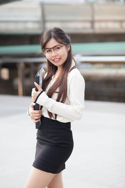 Happly asian businesswoman hold paper.