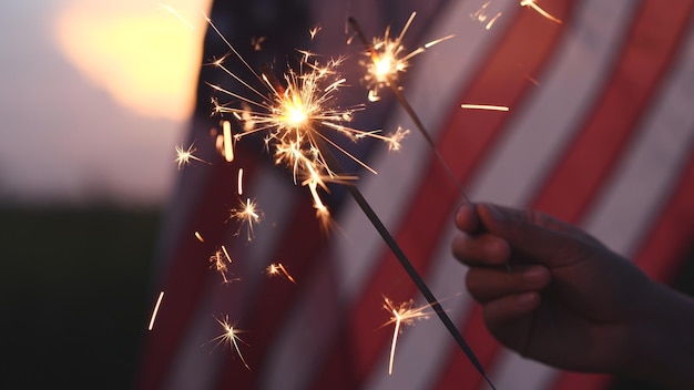 Happy 4th of July Independence Day Hand holding Sparkler fireworks USA celebration