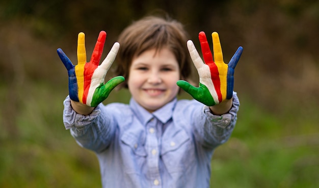 A happy active young kid posing outdoor