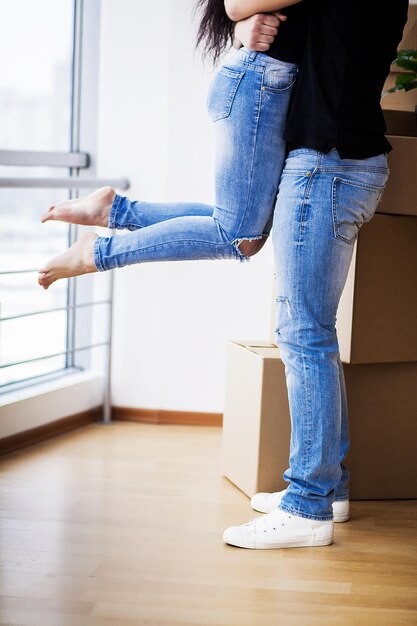 Happy adult couple moving out or in to new home