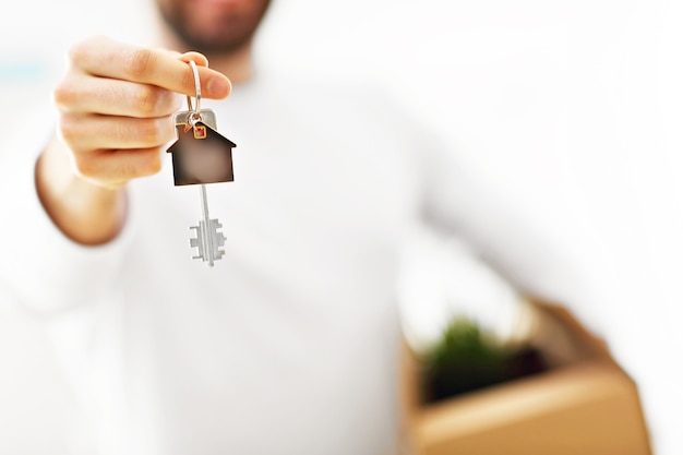 happy adult couple moving out or in to new home