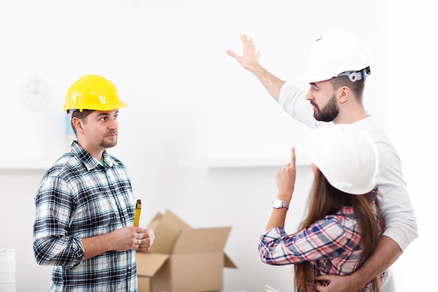 happy adult couple moving out or in to new home