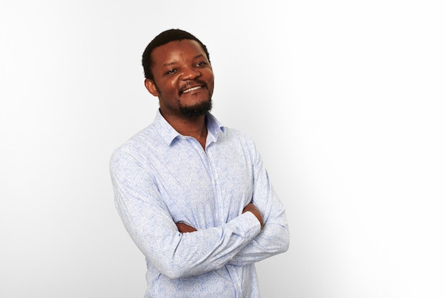 Happy african american black man with crossed arms in casual bright shirt isolated white background