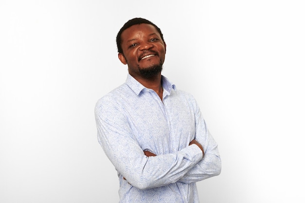 Happy african american black man with crossed arms in casual bright shirt isolated white background