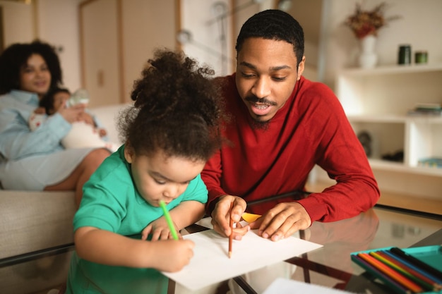 Photo happy african american family spending time together at home