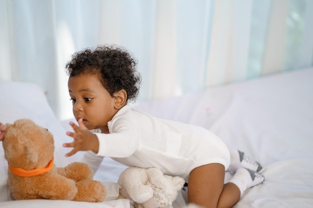 Happy African American Little baby boy crawling and looking for some thing to learn