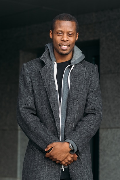 Happy African American male. Street fashion. Joyful black man smile, stylish model, beauty concept