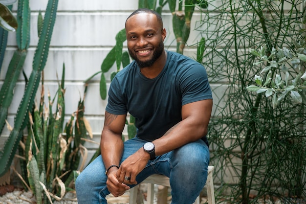 Happy African American man smiling in backyard at home