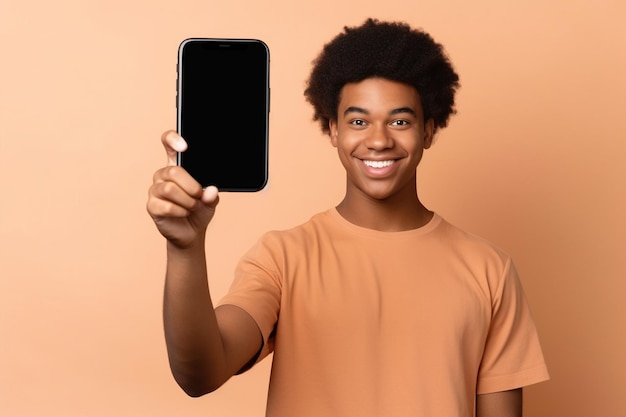 Happy African American teen student holding mobile cell phone pointing finger at smartphone mock up