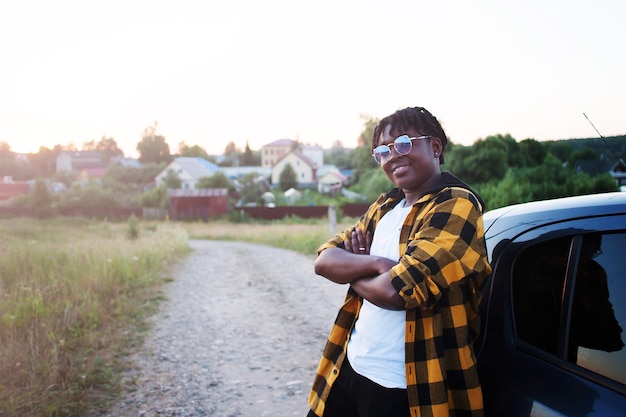 Happy african american woman in a car, lifestyle