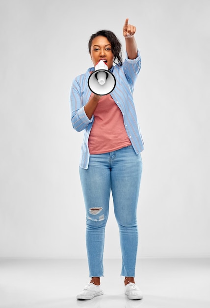 happy african american woman over grey background