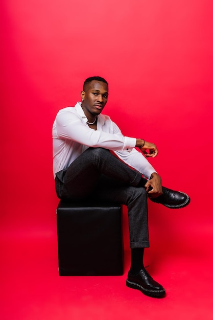 Happy african american young businessman in formal suit smiling confident black guy