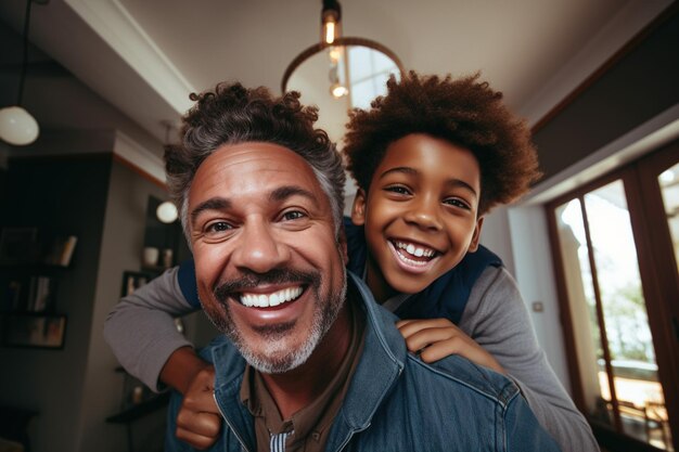 Photo happy african black father having fun with teen boy at home