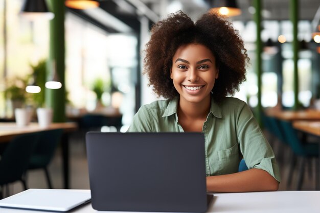 Happy African Black girl student using laptop computer in university library