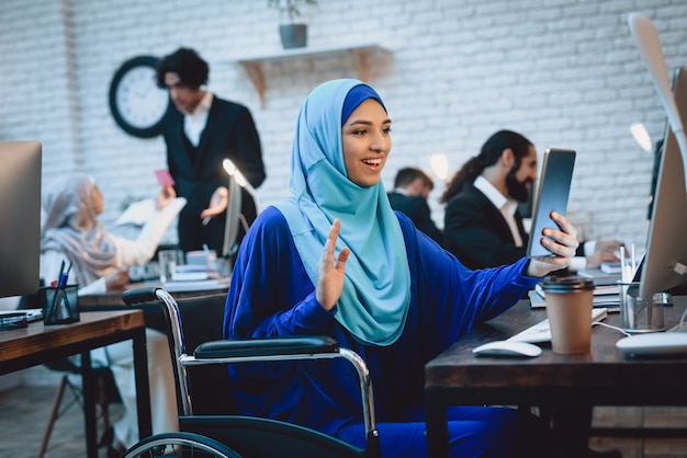 Happy Arab Lady in Wheelchair Makes Video Call.