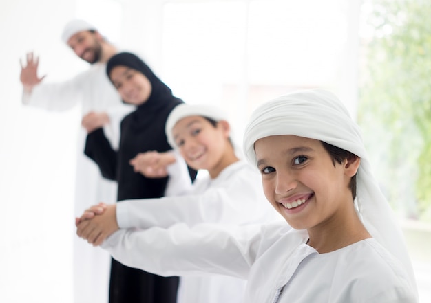 Happy Arabic family having fun at home