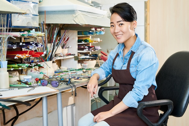 Happy Asian Artist in Workshop