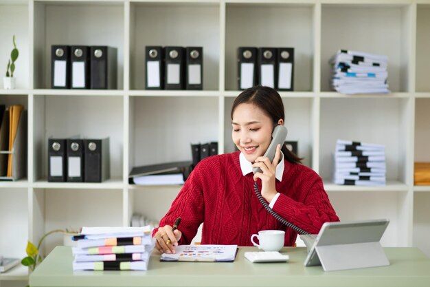 Photo happy asian business woman have the joy of talking on the smartphone tablet and laptopon the office xa