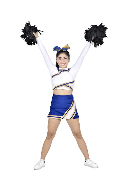 Happy asian cheerleader with pom poms in the air 