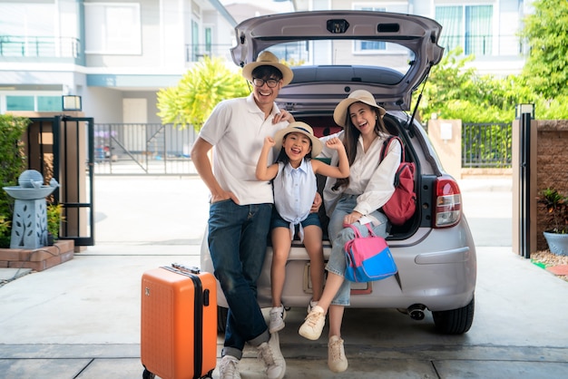 Happy asian family preparing for a trip