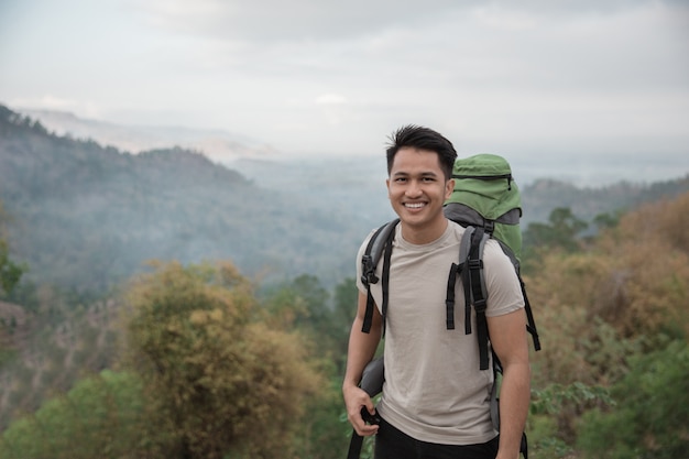 Happy asian hiker.