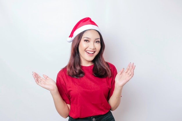 Happy Asian Santa woman is smiling isolated by white background Christmas concept