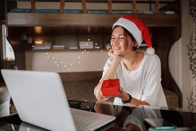 Happy asian woman celebrating friends with video call