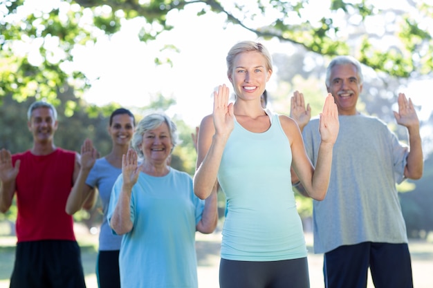 Happy athletic group showing their hands 