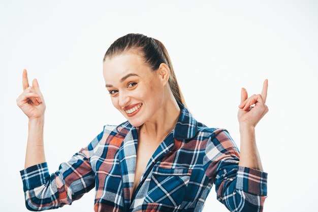 Happy attractive model showing expression Amazed cheerful pretty lady dressed checkered shirt