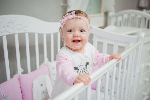 happy baby on a bed at home