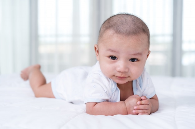 Happy baby on a bed